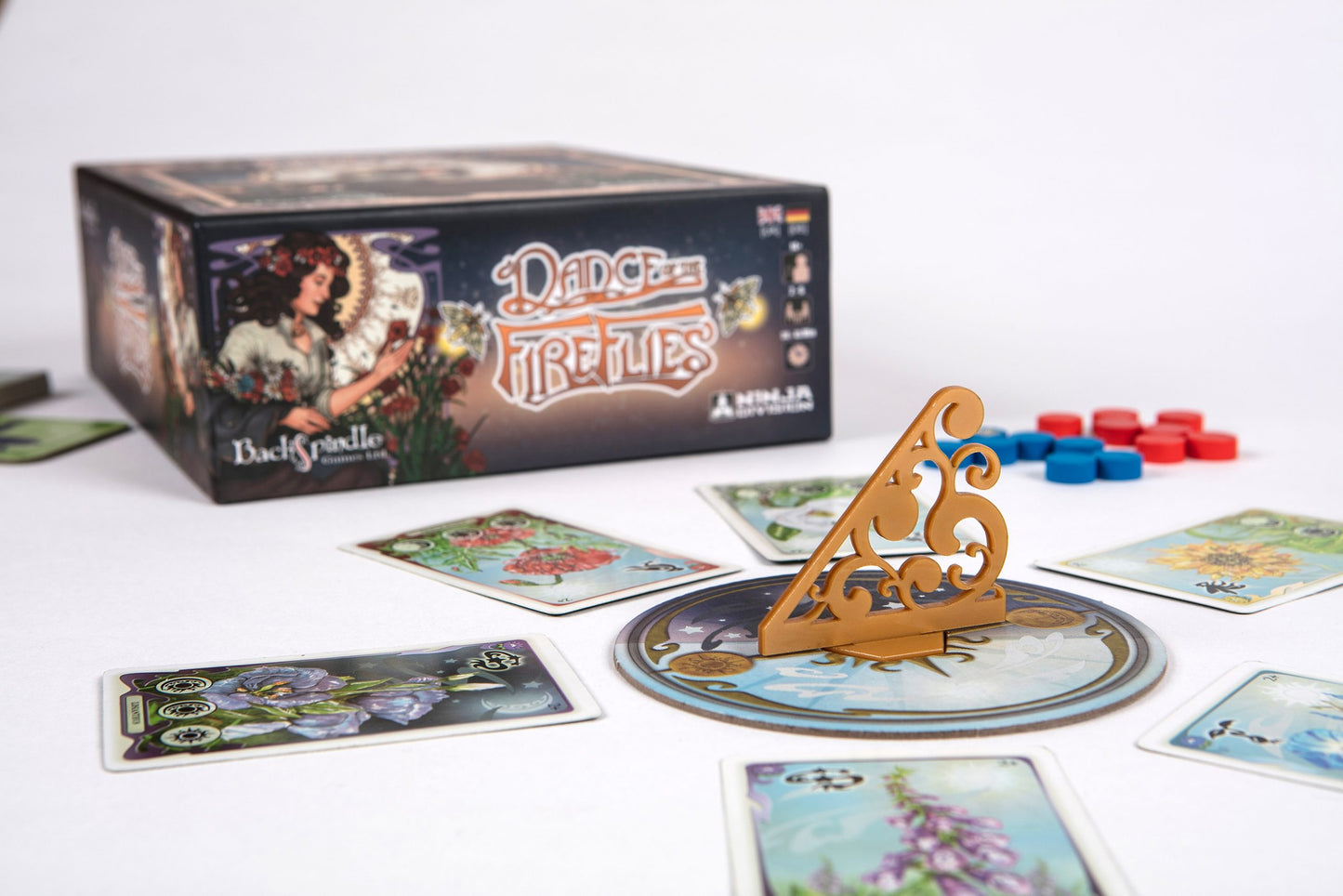 Dance of the Fireflies game box with sundial